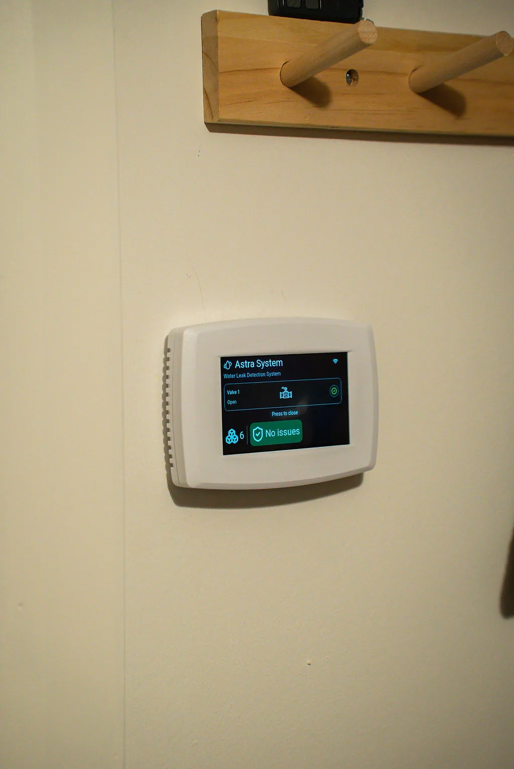 Astra Panel mounted on a wall in a residential utility area