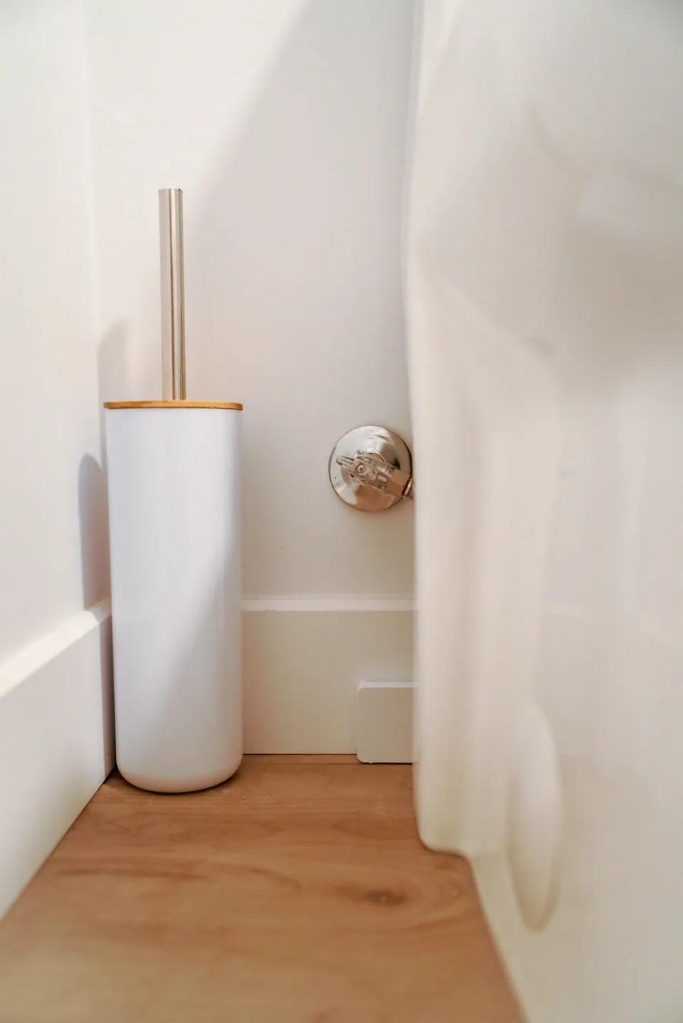 Astra Sensor placed beside a toilet in a bathroom